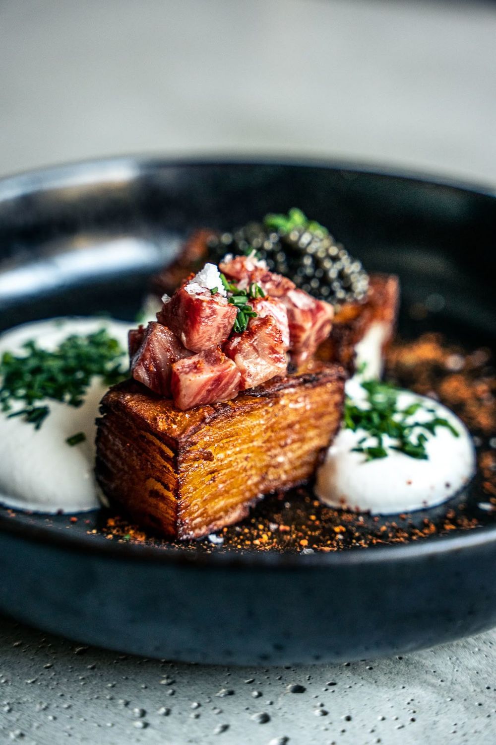 Seared beef over a pressed potato terrine